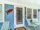 Front door with a screen door and nautical decor at 510 Tighe Ave, Seffner, FL 33584