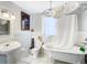 Bathroom with clawfoot tub, pedestal sink, and white subway tile at 510 Tighe Ave, Seffner, FL 33584