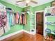Good-sized closet with wood floors and ample shelving and hanging space at 510 Tighe Ave, Seffner, FL 33584