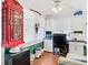 Home office with built-in desk, red telephone booth, and backyard view at 510 Tighe Ave, Seffner, FL 33584