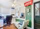 Sunroom office space with built-in desk and a comfy chaise lounge at 510 Tighe Ave, Seffner, FL 33584