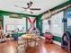 Unique dining area with a round table and cowhide chair at 510 Tighe Ave, Seffner, FL 33584
