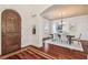 Elegant dining room with chandelier, wood floors, and arched doorway at 4108 W San Luis St, Tampa, FL 33629