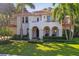 Beautiful two-story house with a red tile roof, arched entryway, and well-maintained landscaping at 4108 W San Luis St, Tampa, FL 33629