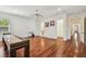 Large game room with hardwood floors, ceiling fan, and multiple access points at 4108 W San Luis St, Tampa, FL 33629