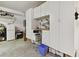 Spacious garage with storage cabinets, work area, and clean concrete flooring at 4108 W San Luis St, Tampa, FL 33629