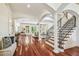 Spacious living area with hardwood floors, arches, and staircase at 4108 W San Luis St, Tampa, FL 33629