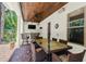 Relaxing outdoor patio with a bar, tv, and ceiling fan at 4108 W San Luis St, Tampa, FL 33629