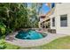 Inviting kidney-shaped pool with brick decking at 4108 W San Luis St, Tampa, FL 33629
