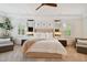 Main bedroom with king-size bed and plenty of natural light at 5013 W Leona St, Tampa, FL 33629
