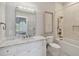 Bathroom with white vanity, marble countertop, and a modern shower at 5013 W Leona St, Tampa, FL 33629