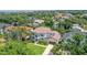 Aerial view of a beautiful home with a large yard and bay views at 5013 W Leona St, Tampa, FL 33629