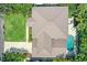 Bird's-eye view of home, pool, and lush landscaping at 5013 W Leona St, Tampa, FL 33629