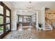 Bright and spacious entryway with hardwood floors and a stunning chandelier at 5013 W Leona St, Tampa, FL 33629