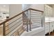 Modern staircase with metal railing and carpeted steps at 5013 W Leona St, Tampa, FL 33629