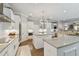 White kitchen with large island, stainless steel appliances, and ample counter space at 5013 W Leona St, Tampa, FL 33629
