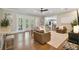 Relaxing living area with hardwood floors, comfy seating, and French doors at 5013 W Leona St, Tampa, FL 33629