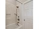 Bathroom with a white subway tile shower, a new bathtub, and modern fixtures at 5013 W Leona St, Tampa, FL 33629