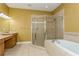 Bathroom with soaking tub and shower at 10426 La Mirage Ct, Tampa, FL 33615