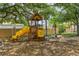 Wooden playground structure with yellow slide, perfect for  at 10426 La Mirage Ct, Tampa, FL 33615