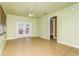Spacious Gathering room with tile floors, access to other rooms, and ceiling fan at 10426 La Mirage Ct, Tampa, FL 33615