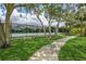 Well-maintained tennis court with walking path nearby at 10426 La Mirage Ct, Tampa, FL 33615
