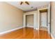 Bedroom with wood floors, double door closet and access to bathroom at 10426 La Mirage Ct, Tampa, FL 33615