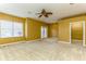 Spacious bedroom with carpeted floors and ceiling fan at 10426 La Mirage Ct, Tampa, FL 33615