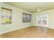 Bright Gathering room featuring tile floors, sliding glass doors, and ceiling fan at 10426 La Mirage Ct, Tampa, FL 33615