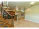 Open floor plan with tile floors and a wooden staircase at 10426 La Mirage Ct, Tampa, FL 33615