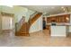 Open concept living space with kitchen and staircase views at 10426 La Mirage Ct, Tampa, FL 33615
