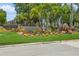 The Villages of Bayport entrance, featuring tropical landscaping at 10426 La Mirage Ct, Tampa, FL 33615