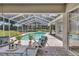 Enjoy this refreshing screened pool and patio area with plenty of seating at 805 Woodcarver Ln, Brandon, FL 33510