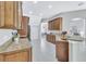 Open concept kitchen with granite counters and island at 805 Woodcarver Ln, Brandon, FL 33510