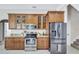 Modern kitchen with stainless steel appliances and granite countertops at 805 Woodcarver Ln, Brandon, FL 33510
