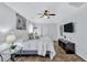 Large main bedroom with king bed and mounted TV at 805 Woodcarver Ln, Brandon, FL 33510