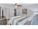 Bright bedroom with a queen-size bed and access to the bathroom at 805 Woodcarver Ln, Brandon, FL 33510