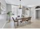 Elegant dining room with chandelier and a view to the kitchen at 805 Woodcarver Ln, Brandon, FL 33510