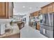 Modern kitchen with granite countertops and stainless steel appliances at 805 Woodcarver Ln, Brandon, FL 33510