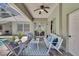 Covered patio with comfortable seating and views of the pool and interior at 805 Woodcarver Ln, Brandon, FL 33510