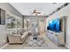 Gathering-friendly living room with large sectional and wall-mounted TV at 805 Woodcarver Ln, Brandon, FL 33510