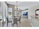 Bright dining area with glass table and view of pool at 805 Woodcarver Ln, Brandon, FL 33510