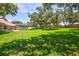 Large grassy backyard offering plenty of space for outdoor enjoyment at 805 Woodcarver Ln, Brandon, FL 33510