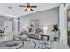 Bright living room with gray sofa and glass-top coffee table at 805 Woodcarver Ln, Brandon, FL 33510