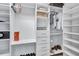 Bright walk-in closet with custom shelving and drawers at 805 Woodcarver Ln, Brandon, FL 33510