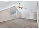 Bright bonus room with vaulted ceiling and carpet at 805 Woodcarver Ln, Brandon, FL 33510