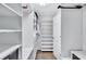 Large walk-in closet with ample shelving and drawers at 805 Woodcarver Ln, Brandon, FL 33510