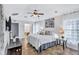 Spacious main bedroom with king-size bed and ensuite bathroom at 805 Woodcarver Ln, Brandon, FL 33510