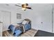 Bright bedroom with ceiling fan and wood-look flooring at 805 Woodcarver Ln, Brandon, FL 33510