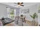 Bright home office with a desk and two ottomans at 805 Woodcarver Ln, Brandon, FL 33510